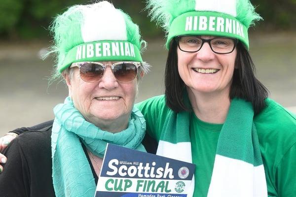 Irene and Julie Grant donned their green and white headgear for the final. Picture: Greg MacVean