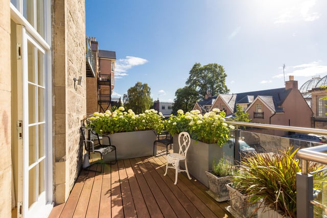 The property features a large balcony and southerly views over the shared garden and grounds.