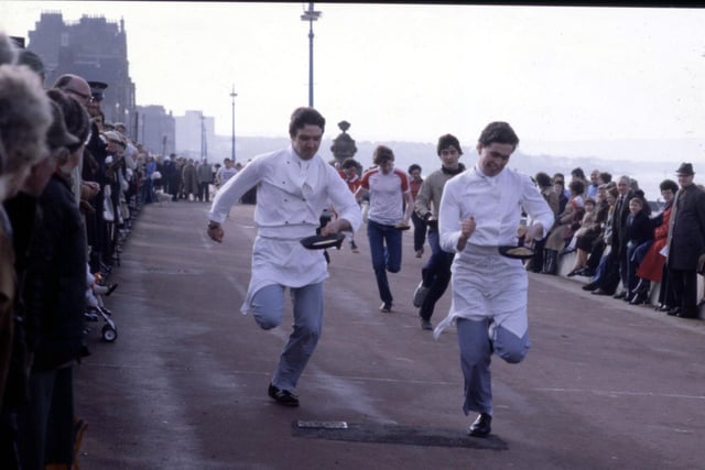 Chefs taking part in a pancake race on Portobello promenade in February 1983.
