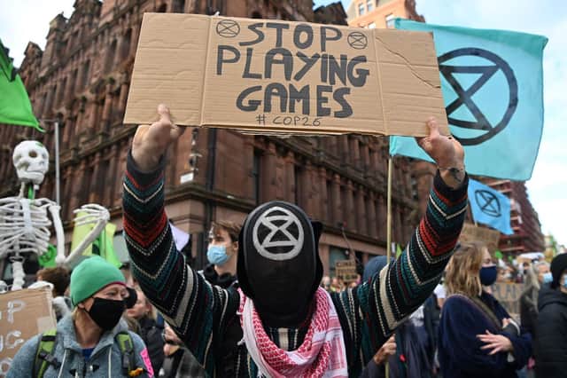 Climate activists march through the streets of Glasgow