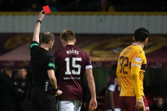 Hearts defender Taylor Moore is sent off at Motherwell.