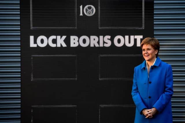 First Minister Nicola Sturgeon poses with an LED display. Picture: Andy Buchanan/AFP/Getty