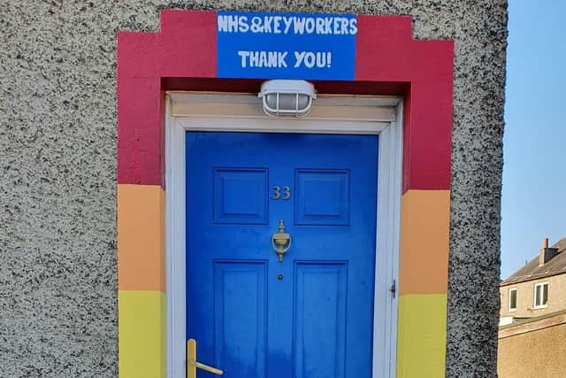 Andrew Aitken has painted his door frame to celebrate the NHS.