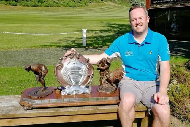 Kingfield's Allyn Dick with the Edinburgh Evening News Trophy after his title triumph at Mortonhall.