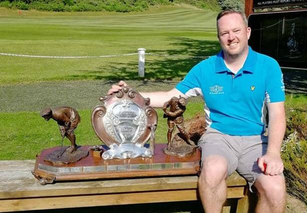 Kingfield's Allyn Dick with the Edinburgh Evening News Trophy after his title triumph at Mortonhall.