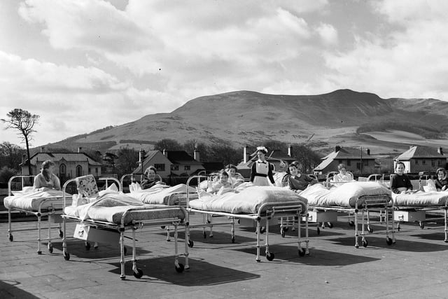 Children basking in the sunshine at Edinburgh's Princess Margaret Rose Orthopaedic Hospital in 1960.