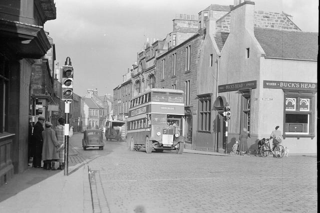 A bus stops at traffic lights at the High Street, Dalkeith, where it was announced in 1953 that a one-way system was to be introduced to ease a bottleneck.