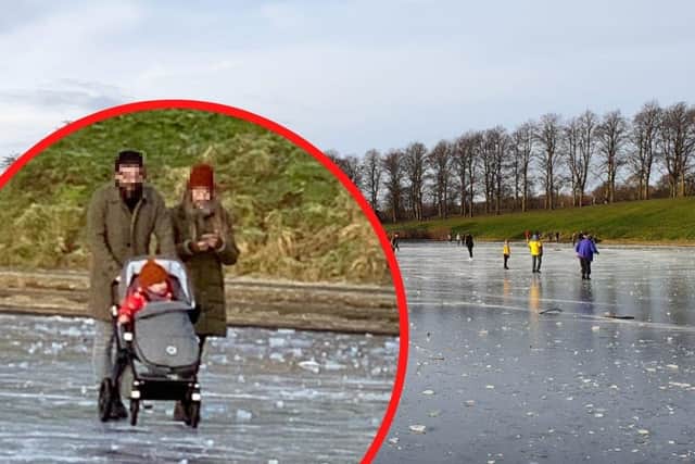 A couple have been spotted pushing a pram over the surface of a frozen pond in Edinburgh, as dozens enjoy the cold weather and sunshine.