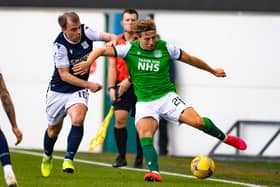 Sean Mackie fends off Paul McGowan during Hibs' last 16 Betfred Cup win over Dundee (Photo by Paul Devlin / SNS Group)(Photo by Paul Devlin / SNS Group)