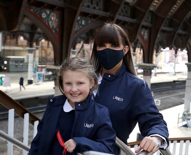 LNER driver Becky Brown and her daughter Maisie at York Station. Picture: Nigel Roddis/PA Wire