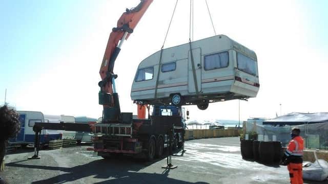 An abandoned caravan is removed from the Portobello site