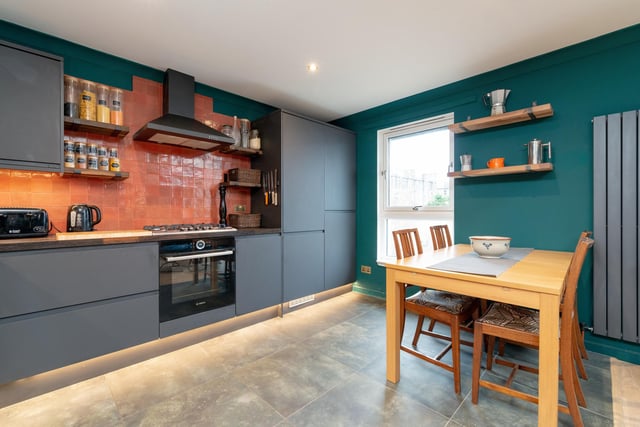 The kitchen is now a stylish open plan space with ample room for a large dining table with a built-in 5 burner gas hob, Bosch oven, integrated fridge freezer and integrated dishwasher.