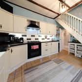 This fully fitted Kitchen has ample floor and wall mounted storage units.