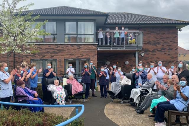 Drumbrae care home, seen with residents taking part in a Clap for Carers in April last year, could be closed and turned into a complex clinical care facility (Picture: Andrew O'Brien)