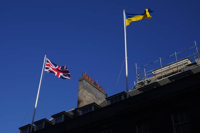 File photo dated 25/02/22 of The Ukrainian flag being flown above 10 Downing Street in London. PA