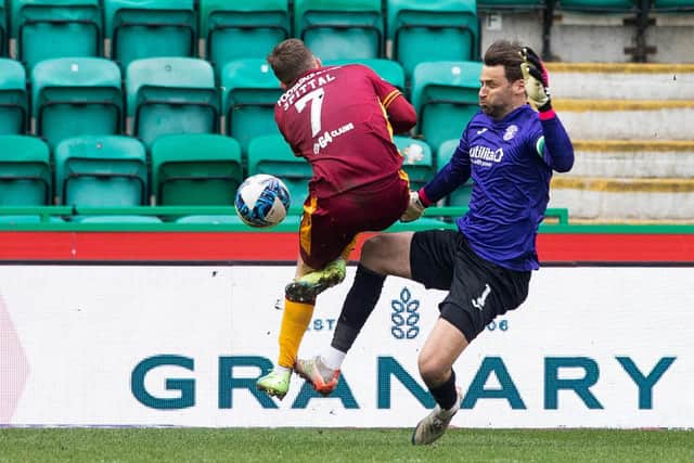 Hibs goalkeeper David Marshall fouls Blair Spittal, giving the away side a penalty. Picture: SNS