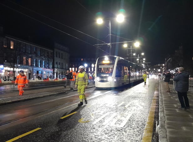 A test tram makes its way along Elm Row at walking pace