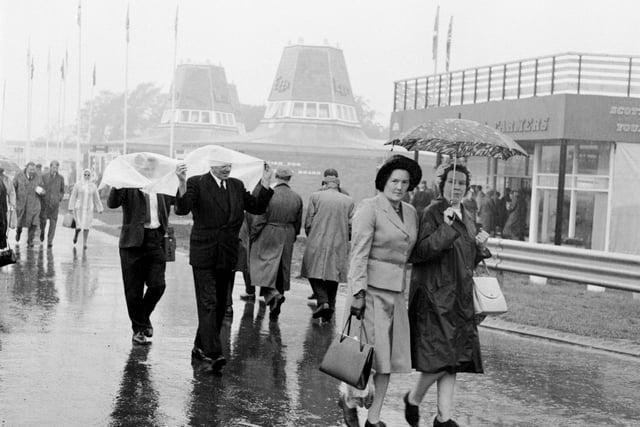 Visitors making their way through the rain and mud at the 1966 Royal Highland Show.