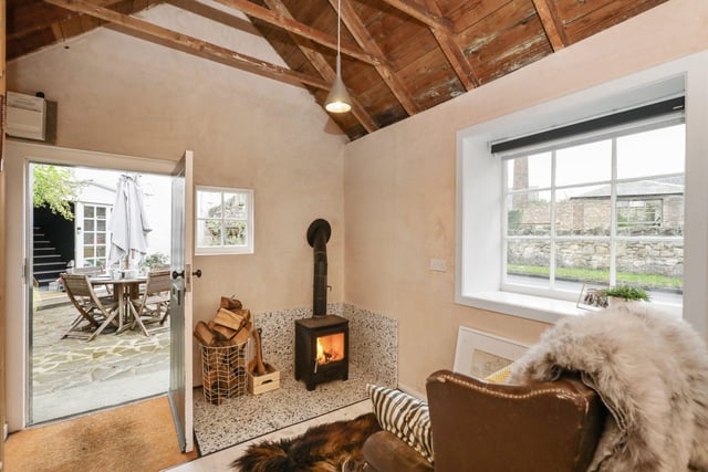 The property has its own workshop with fuel burning stove, providing an ideal home office/studio space.