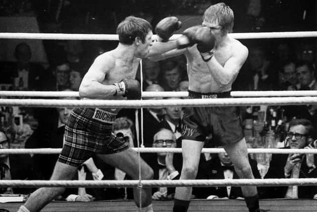 Ken (left) in action in his famous 'Battle of Scotland' fight against Glaswegian Jim Watt in January 1973.