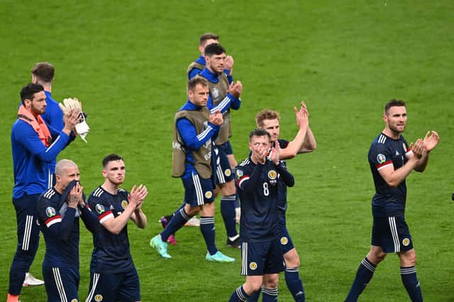 Scotland's players applaud the fans after drawing with England at Wembley.