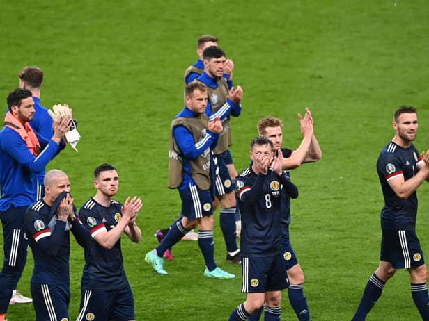 Scotland's players applaud the fans after drawing with England at Wembley.