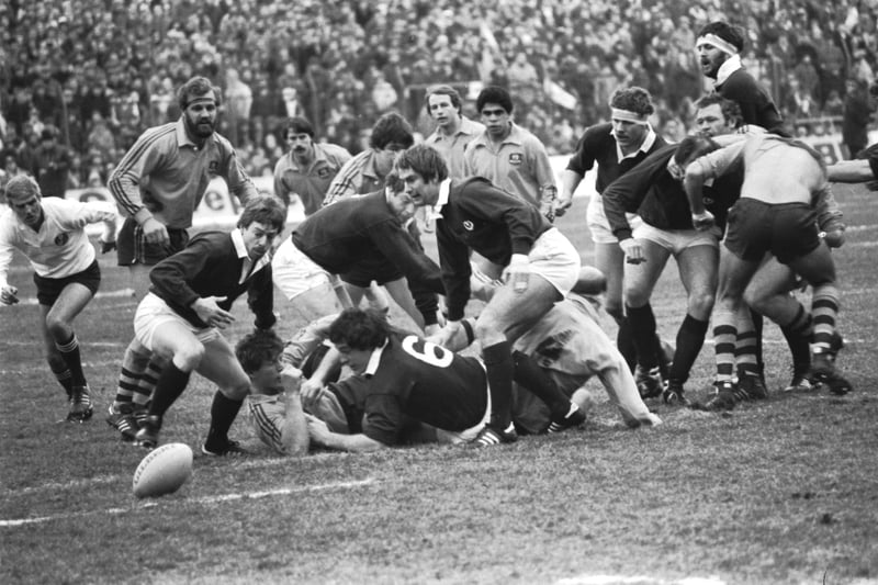 Team-mate Roy Laidlaw goes after the ball passed out by Jim Calder (no 9) during the Scotland v Australia international rugby match at Murrayfield in December 1981. The final score was 24-15 for Scotland.