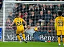 Craig Gordon saves a penalty from Livingston's Sean Kelly, keeping Hearts in the match and setting up a grandstand finish. Picture: SNS