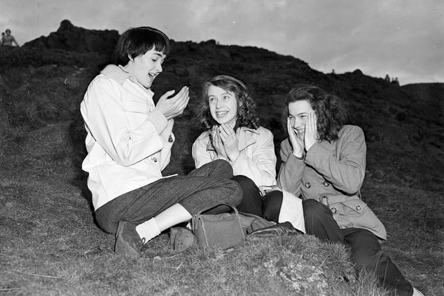 Alex Shewan, Mary Carmichael and Moira Moodie May wash their faces in the morning after a May Day service on Arthur's Seat.