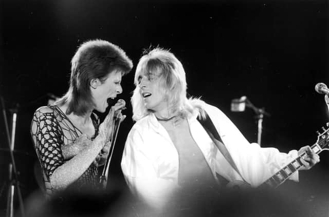 David Bowie performs with guitarist Mick Ronson at The Marquee Club in London in 1973 (Picture: Jack Kay/Daily Express/Getty Images)