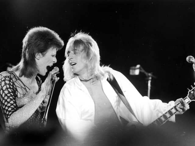 David Bowie performs with guitarist Mick Ronson at The Marquee Club in London in 1973 (Picture: Jack Kay/Daily Express/Getty Images)