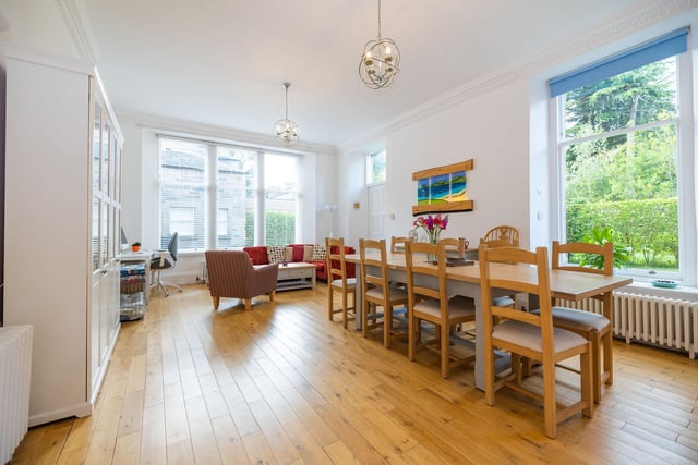 This large dining room area off the kitchen perfectly showcases the space and amount of natural light in this good-sized ground floor flat.