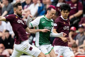 Hibs forward Harry McKirdy is marshalled by Orestis Kiomourtzoglou and Yutaro Oda of Hearts. Picture: Ross Parker/SNS Group