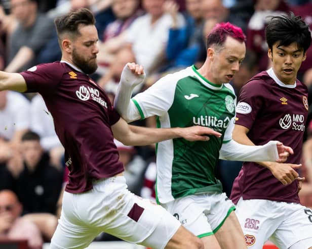 Hibs forward Harry McKirdy is marshalled by Orestis Kiomourtzoglou and Yutaro Oda of Hearts during the last derby meeting. Picture: Ross Parker/SNS Group