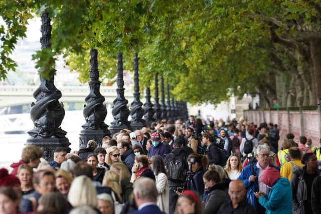 Members of the public join the queue on London's South Bank, as they wait to view the Queen's coffin at the lying in state.   Photo: Stefan Rousseau/PA Wire