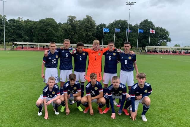 Jacob MacIntyre and Rudi Molotnikov (front row, second and third left) with their Scotland team-mates ahead of the game