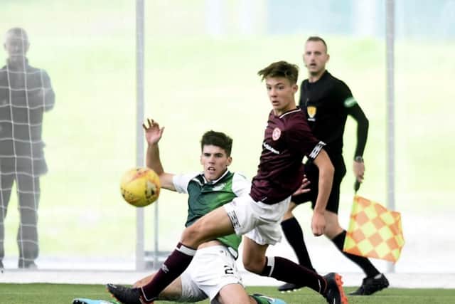 Kane O'Connor in action for Hibs against Hearts' Aaron Hickey in the SPFL Reserve Cup in September 2018