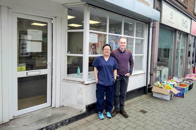 Husband and wife team Marc Stuart and Ying Peng outside the Penicuik Podiatrist Clinic.