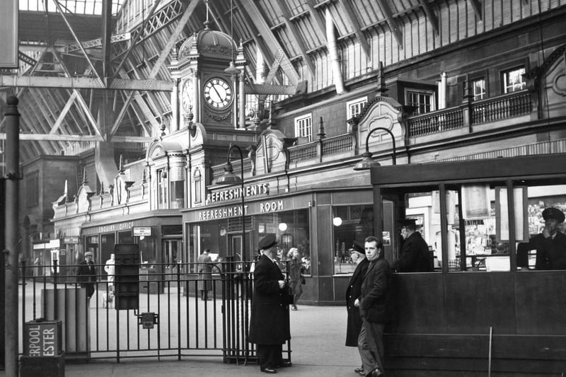 The interior of Princes Street Station showing a platform entrance and the ornate refreshments bar in 1963.