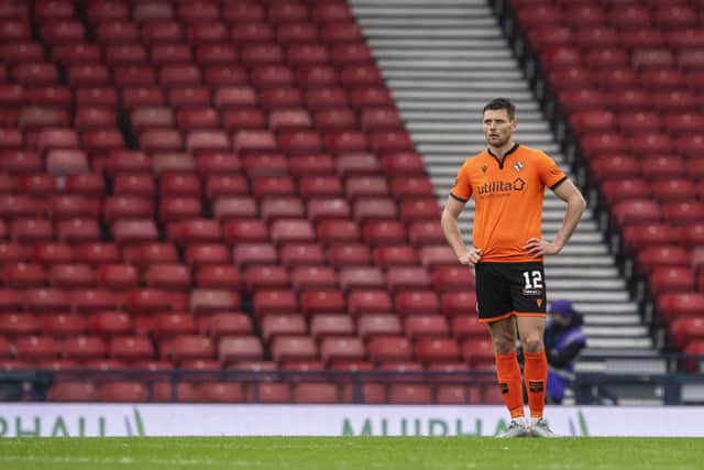 Dundee Utd's Ryan Edwards comes to terms with his side's Scottish Cup semi-final defeat to Hibs. (Photo by Ross Parker / SNS Group)