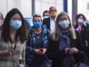 Crowd of people walking wearing masks. New postcode tracker is launched today as the country's council areas enter new five level system picture: JPI Media