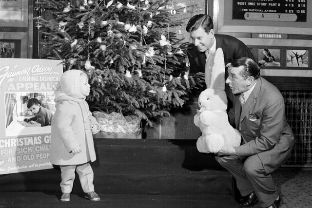 Lex McLean hands in a huge rabbit to Edinburgh's New Victoria Cinema as part of a charity present appeal in November 1962.