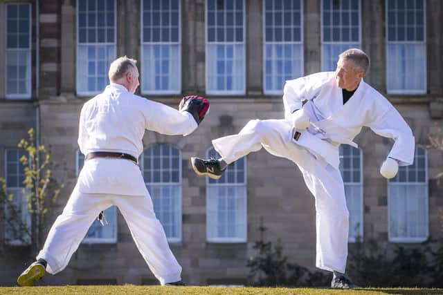 Lib Dem leader Willie Rennie (right) taking part in a karate lesson with Robert Steggles at The Meadows