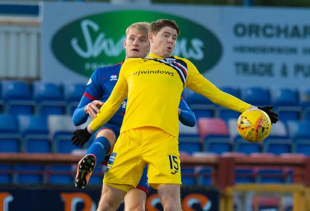 Coll Donaldson (left) challenges Kevin Nisbet during a match between Inverness CT and Dunfermline last January