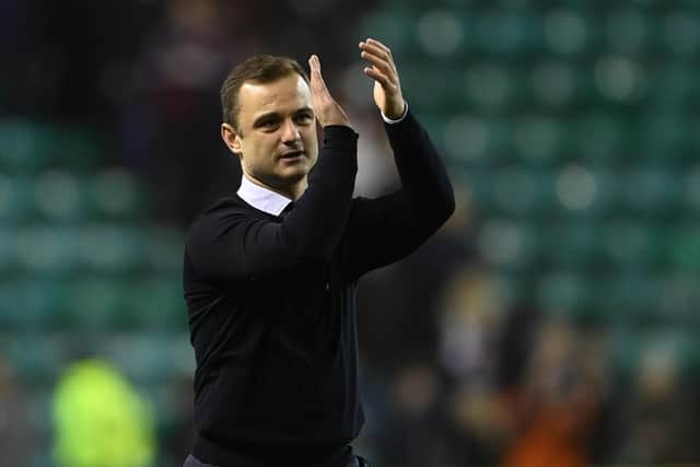 Shaun Maloney applauds the fans at full time