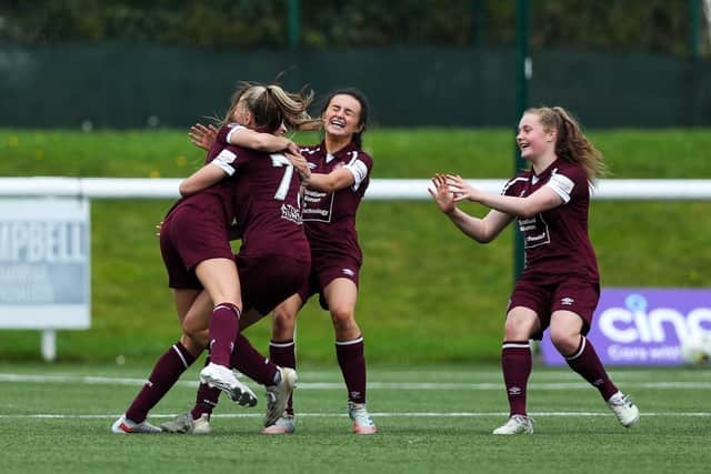 Claire Delworth, left, is hugged by Maria McAneny and Aimee Anderson while Amelie Birse joins in the celebrations. The latter three have all been selected for the next Scotland under-19s squad. Picture: Chris Doyle