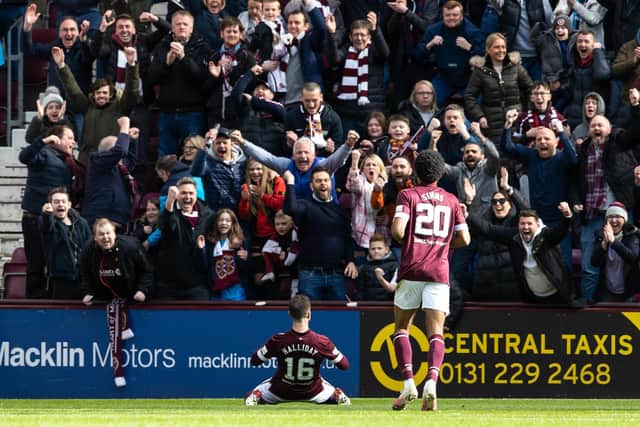 Andy Halliday celebrates his second goal in front of the Hearts fans to make it 3-1