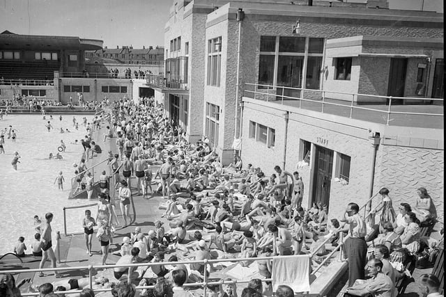 A packed poolside in 1956.