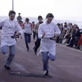 Chefs taking part in a pancake race on Portobello promenade in February 1983.