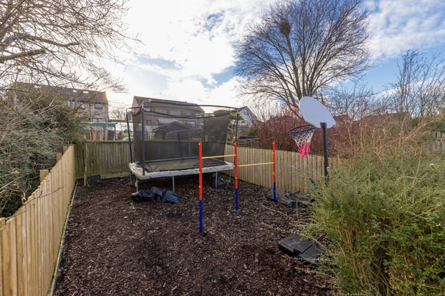 The back part of the rear garden is currently home to a large trampoline.